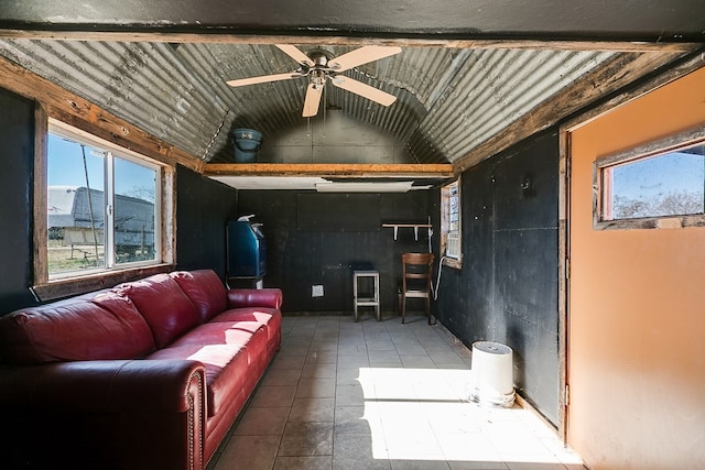 living room with vaulted ceiling with beams and ceiling fan