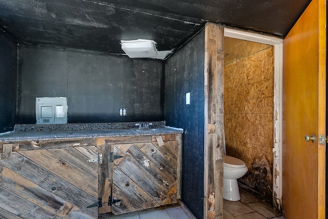 bathroom featuring tile patterned floors and toilet