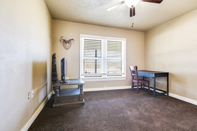 office with ceiling fan and a textured ceiling