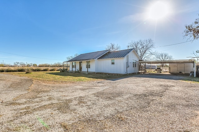 view of property exterior with a carport