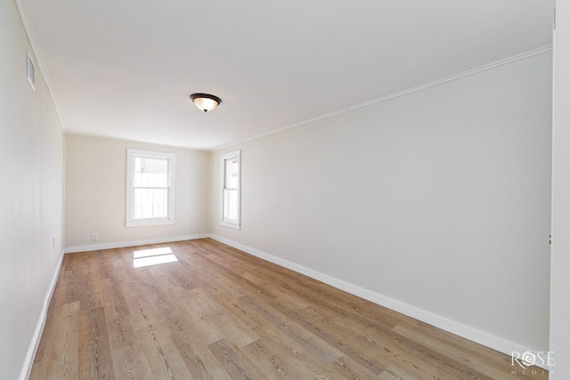 34 W 9th St, San Angelo, TX 76903 - unfurnished room featuring light wood finished floors and ornamental molding