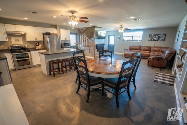 dining space featuring ceiling fan