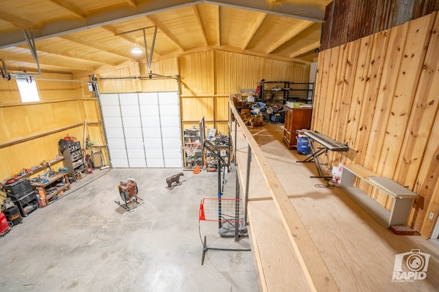 garage featuring wood walls