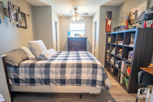 bedroom featuring ceiling fan and light hardwood / wood-style floors