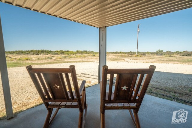 view of patio with a rural view