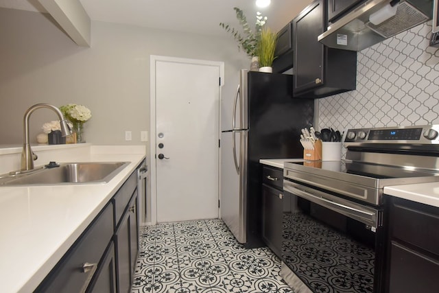 kitchen featuring sink, wall chimney range hood, light tile patterned floors, stainless steel appliances, and backsplash