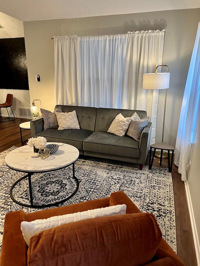 living room with wood finished floors