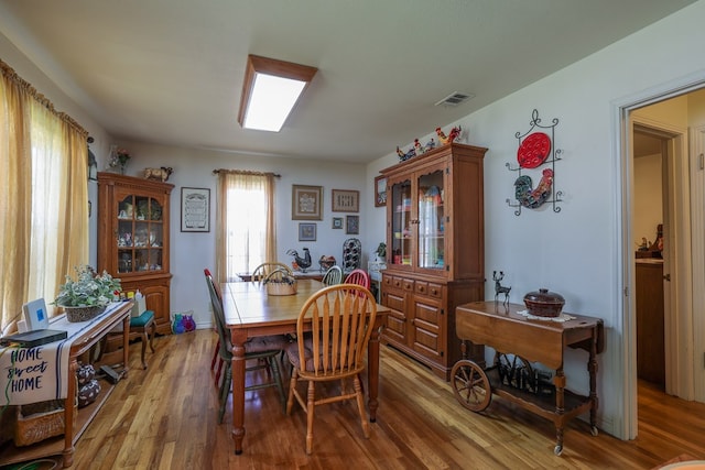 dining area with hardwood / wood-style floors