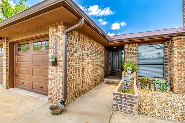 doorway to property featuring a garage