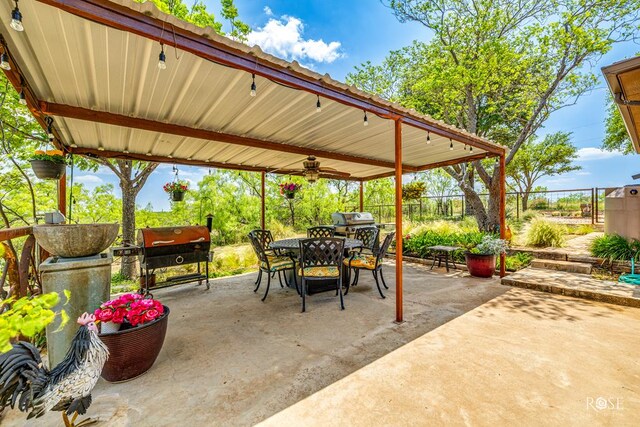 view of patio / terrace featuring area for grilling and ceiling fan