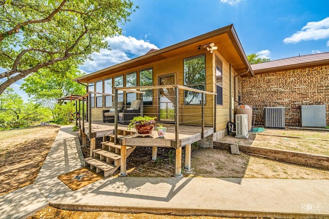 view of patio featuring a wooden deck and cooling unit