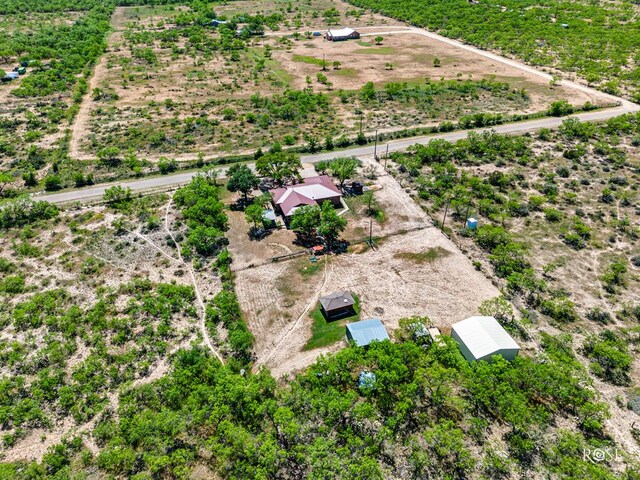 birds eye view of property with a rural view