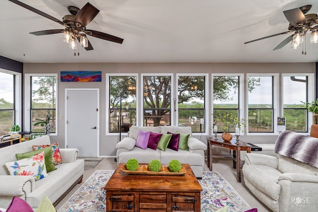 sunroom / solarium featuring ceiling fan