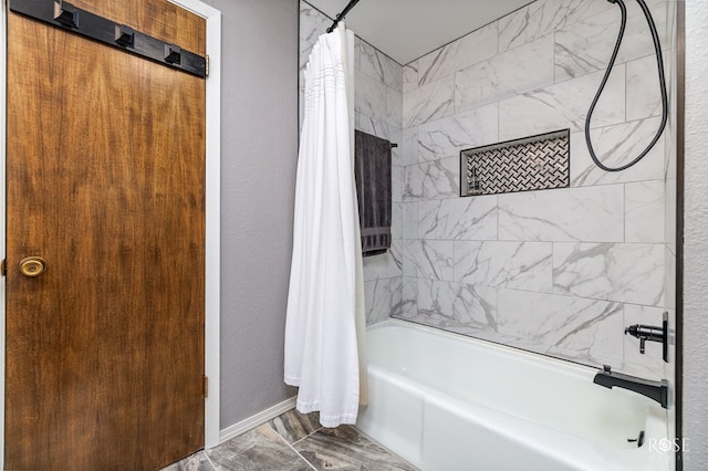 bathroom with shower / tub combo with curtain