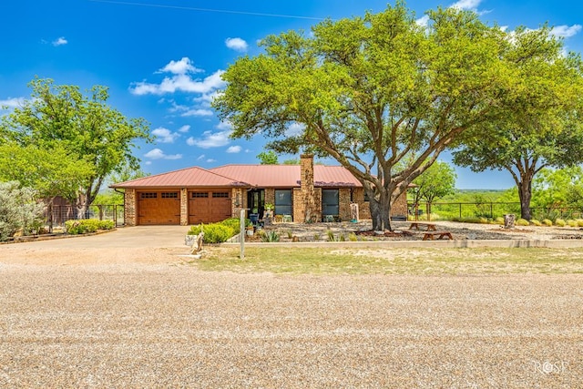 ranch-style house featuring a garage