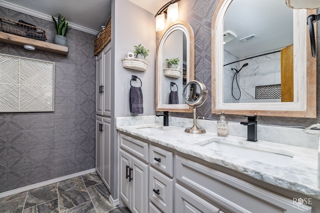 bathroom featuring vanity, crown molding, and a shower