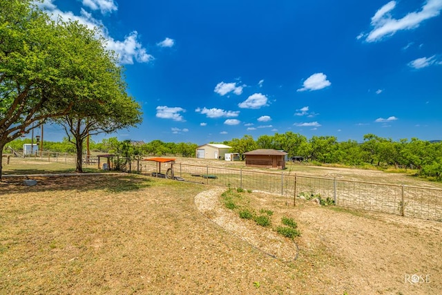 view of yard with a rural view