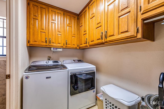 laundry room featuring cabinet space and independent washer and dryer