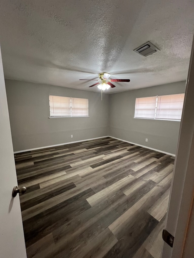 3222 Southland Blvd, San Angelo, TX 76904 - spare room with a textured ceiling, ceiling fan, and wood finished floors