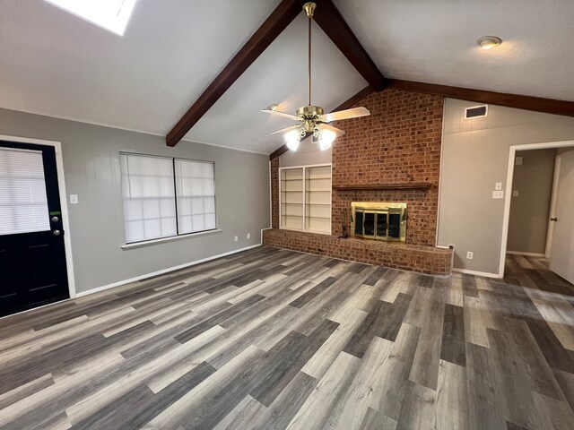 3222 Southland Blvd, San Angelo, TX 76904 - unfurnished living room with wood finished floors, ceiling fan, and a fireplace