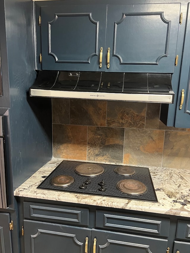 3222 Southland Blvd, San Angelo, TX 76904 - kitchen view of black electric stovetop, backsplash, and ventilation hood