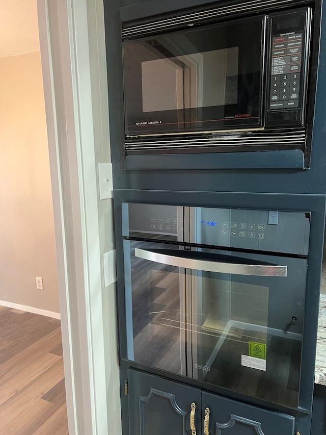 3222 Southland Blvd, San Angelo, TX 76904 - kitchen view of black appliances and wood finished floors