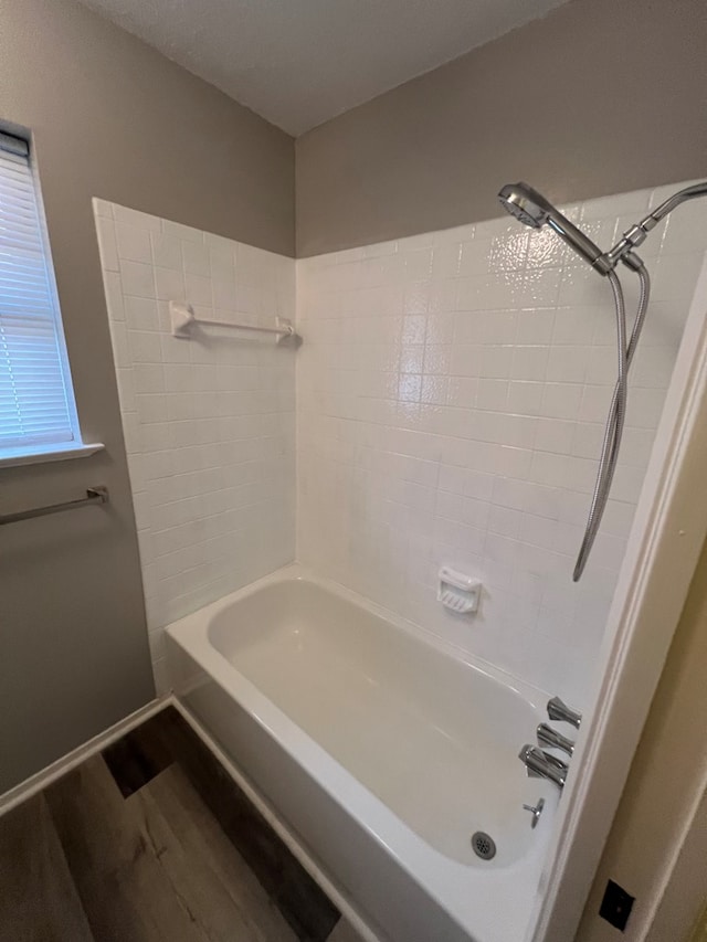 3222 Southland Blvd, San Angelo, TX 76904 - full bath featuring wood finished floors and bathtub / shower combination