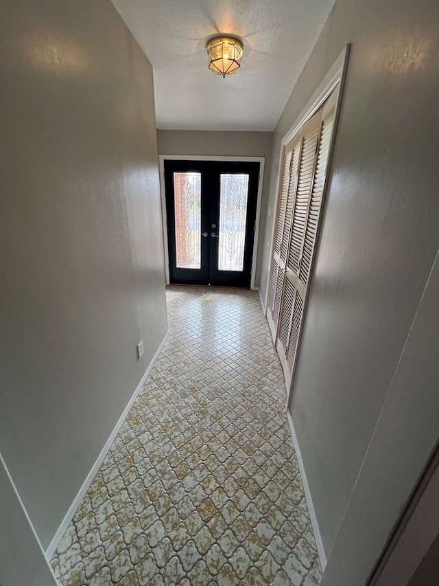 3222 Southland Blvd, San Angelo, TX 76904 - corridor featuring french doors and baseboards