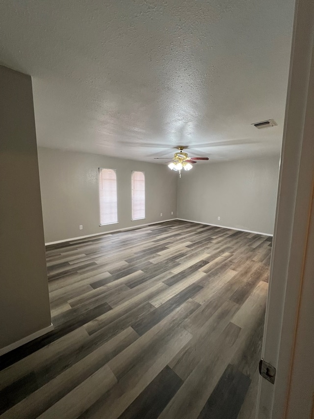 3222 Southland Blvd, San Angelo, TX 76904 - unfurnished room with wood finished floors, ceiling fan, and a textured ceiling