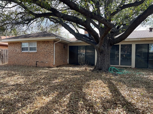 3222 Southland Blvd, San Angelo, TX 76904 - view of property exterior featuring brick siding and a sunroom