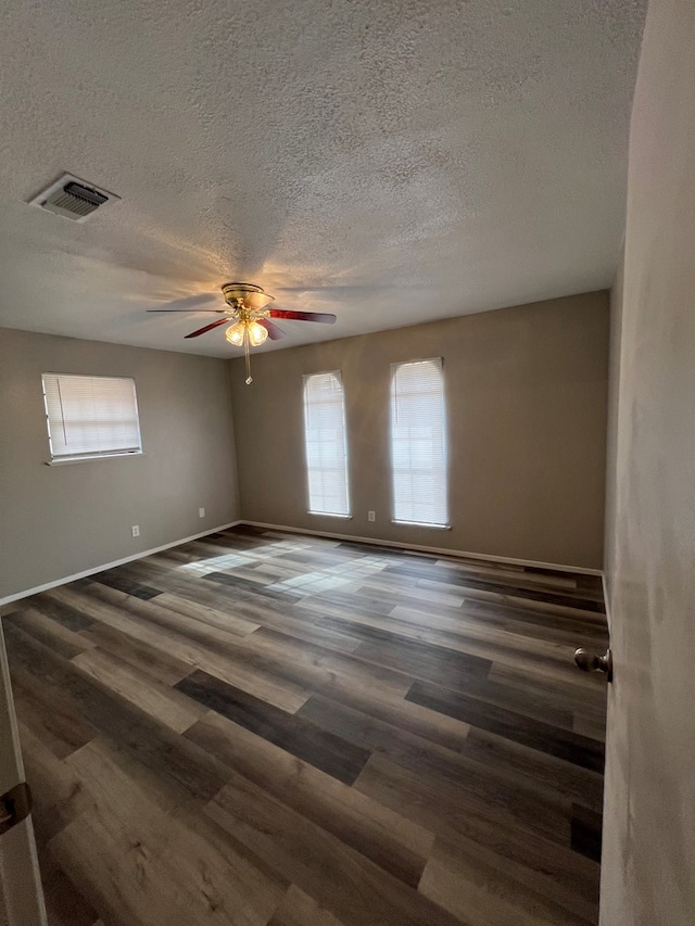 3222 Southland Blvd, San Angelo, TX 76904 - unfurnished room with a ceiling fan, a textured ceiling, and wood finished floors