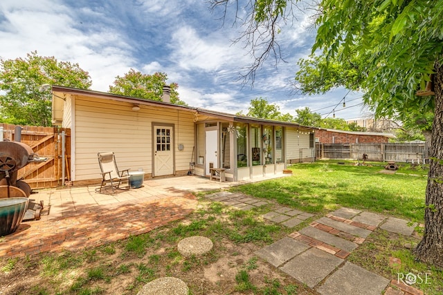 2519 Yale Ave, San Angelo, TX 76904 - rear view of property with a patio, a chimney, and a gate