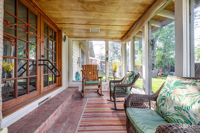 2519 Yale Ave, San Angelo, TX 76904 - sunroom featuring wooden ceiling, brick floors, and french doors
