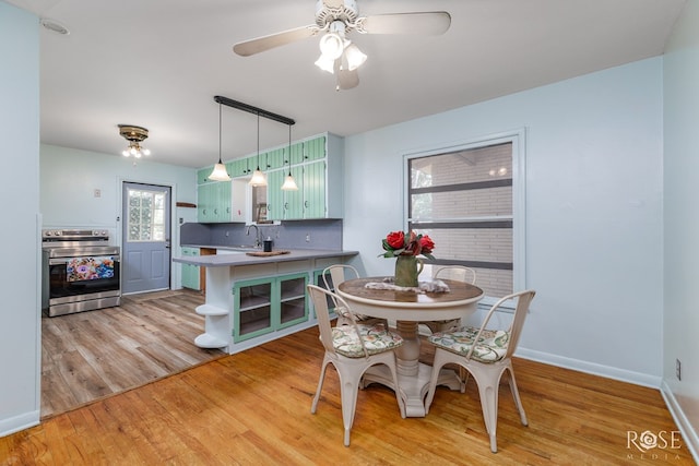 2519 Yale Ave, San Angelo, TX 76904 - dining space with light wood-style flooring, baseboards, and ceiling fan
