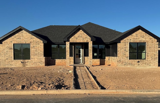 view of front of property with brick siding