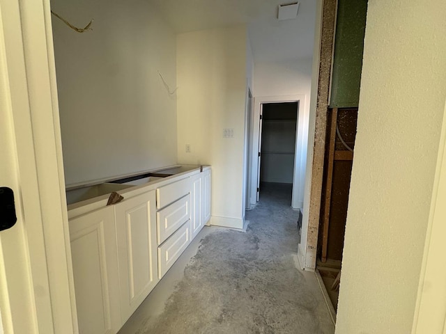 bathroom with unfinished concrete flooring