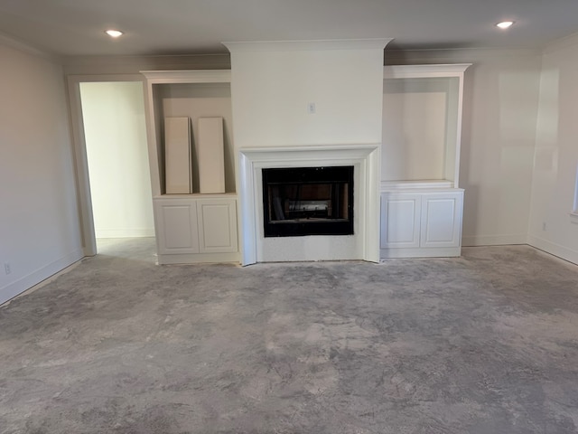 unfurnished living room with crown molding, recessed lighting, a fireplace, and baseboards