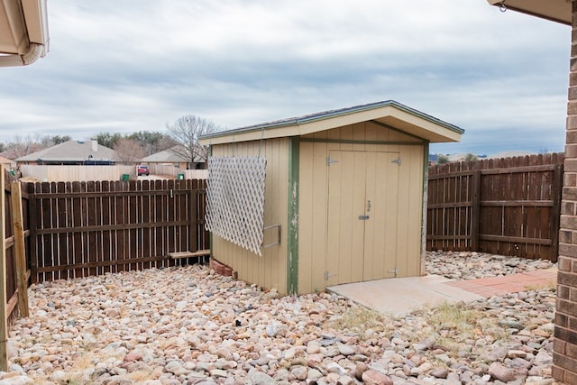 view of shed featuring a fenced backyard