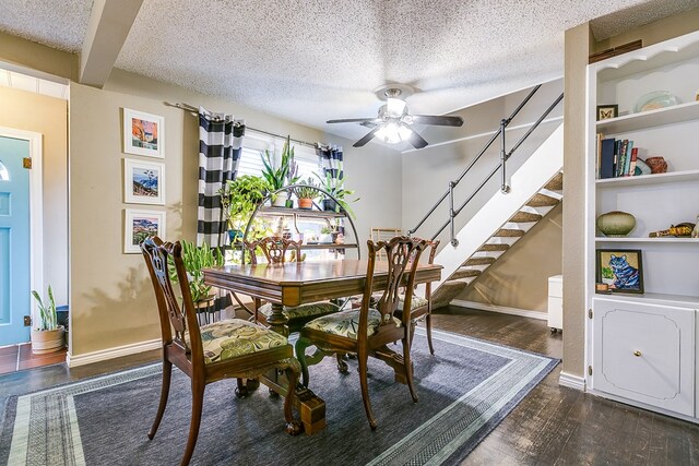 dining space with ceiling fan, dark hardwood / wood-style flooring, built in features, and a textured ceiling