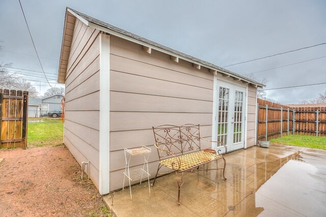 view of outbuilding featuring french doors