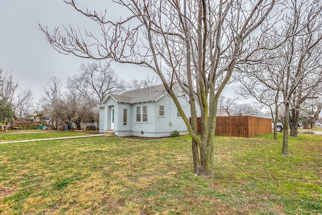 view of home's exterior with a yard