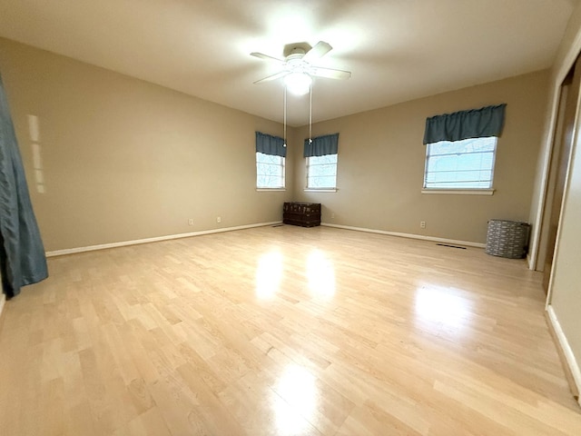 unfurnished bedroom featuring ceiling fan and light wood-type flooring