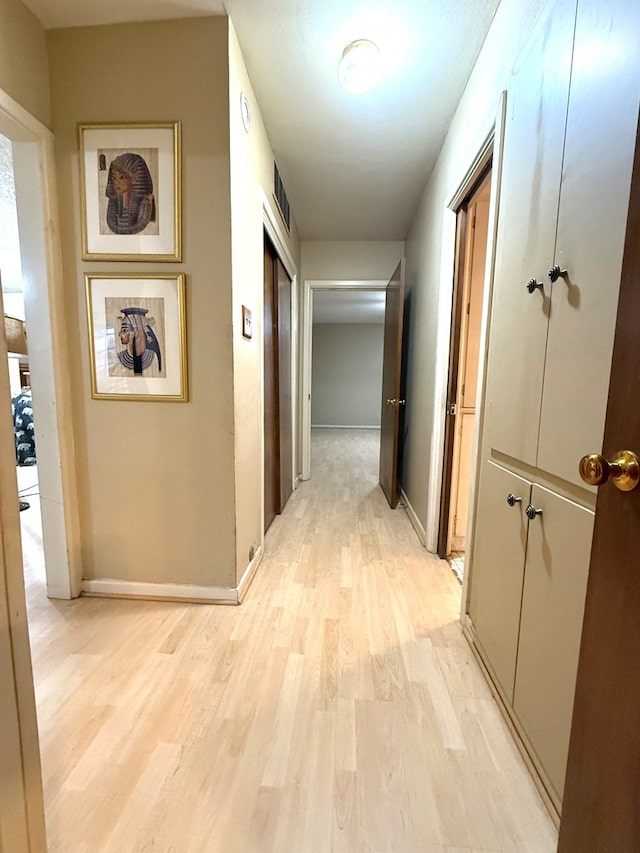 hallway featuring light wood-type flooring