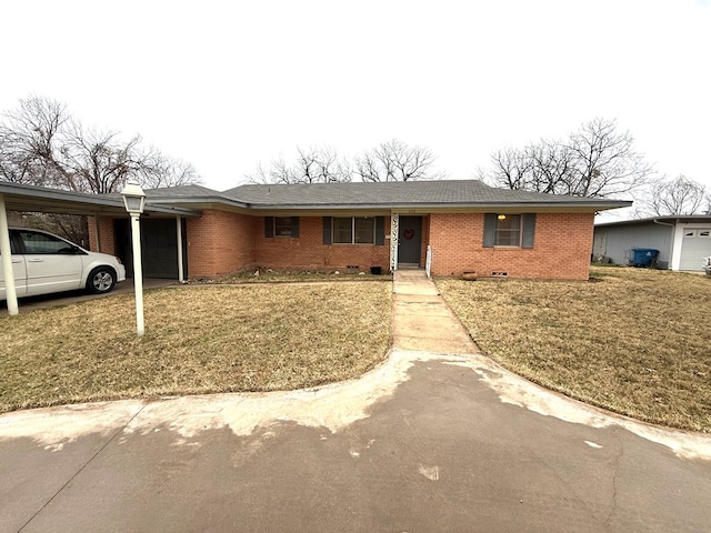 ranch-style home with a carport and a front lawn