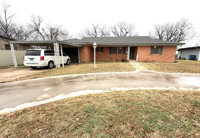 view of front of house featuring a front yard and a carport