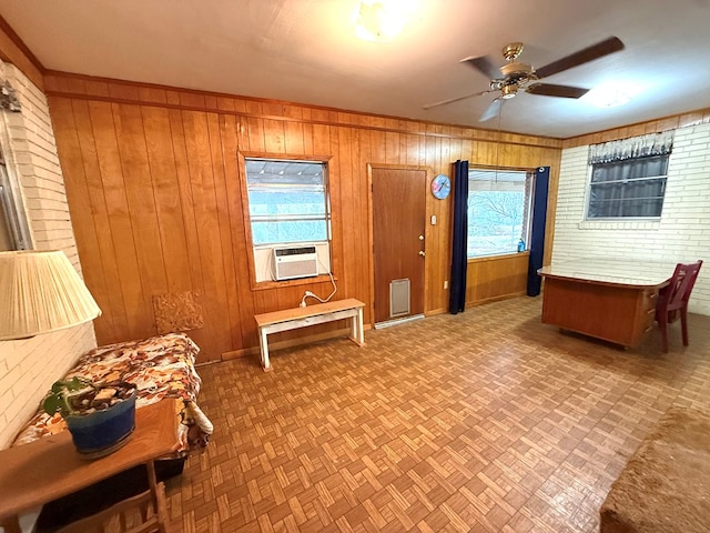 interior space featuring cooling unit, parquet floors, and wood walls