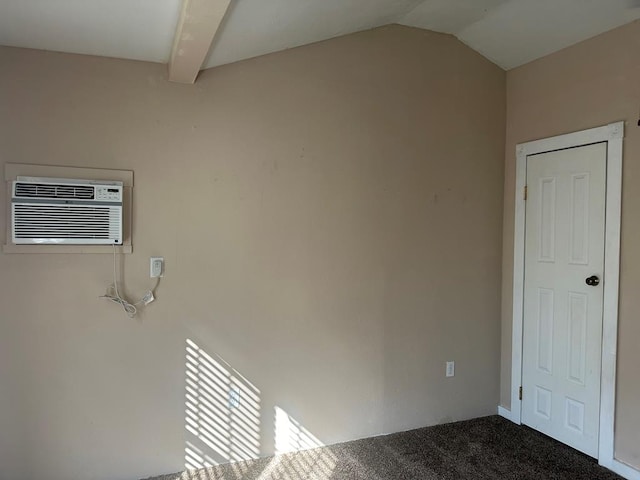 interior space with a wall mounted air conditioner and carpet