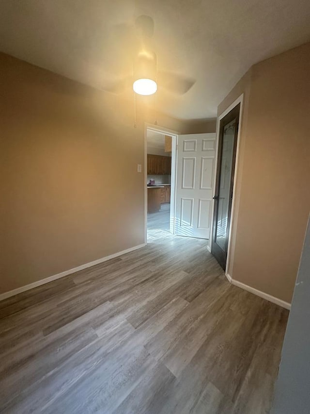 unfurnished room with wood-type flooring