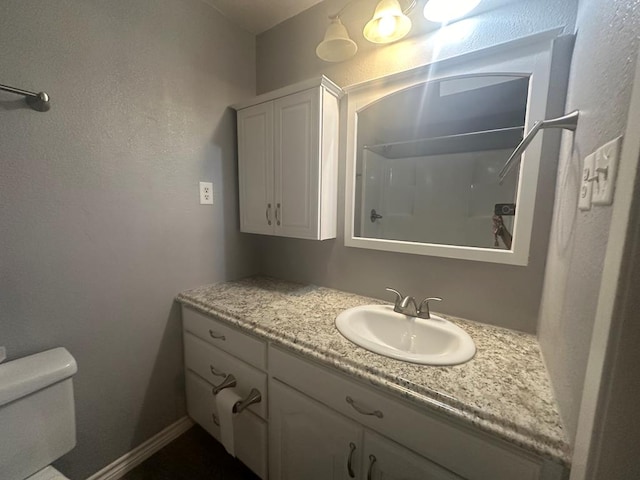 bathroom with vanity and toilet