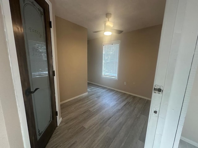 unfurnished room featuring hardwood / wood-style flooring and ceiling fan